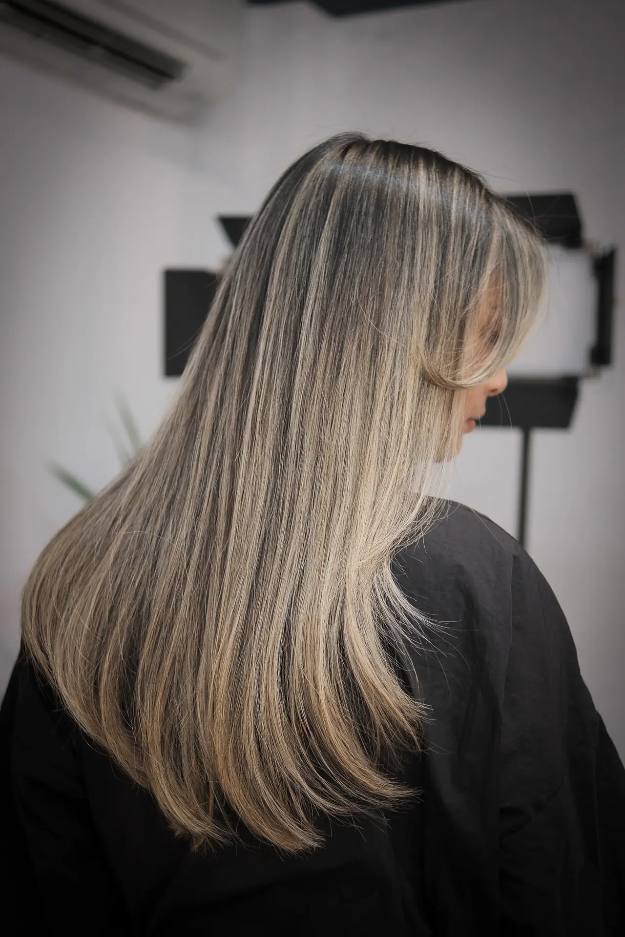 Keratin-treated straight hair with glossy finish at luxury salon in Miami