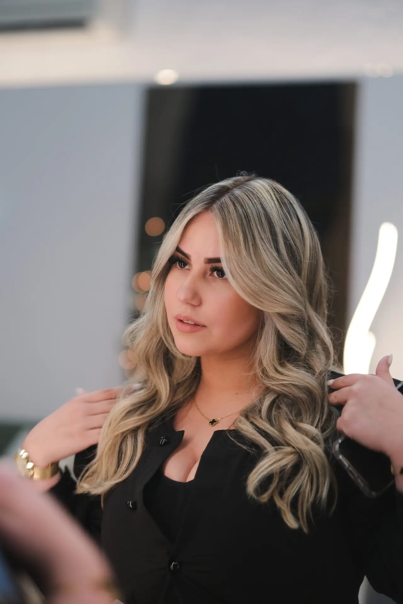 Woman with soft blonde highlights and balayage at Arvel Hair in Miami