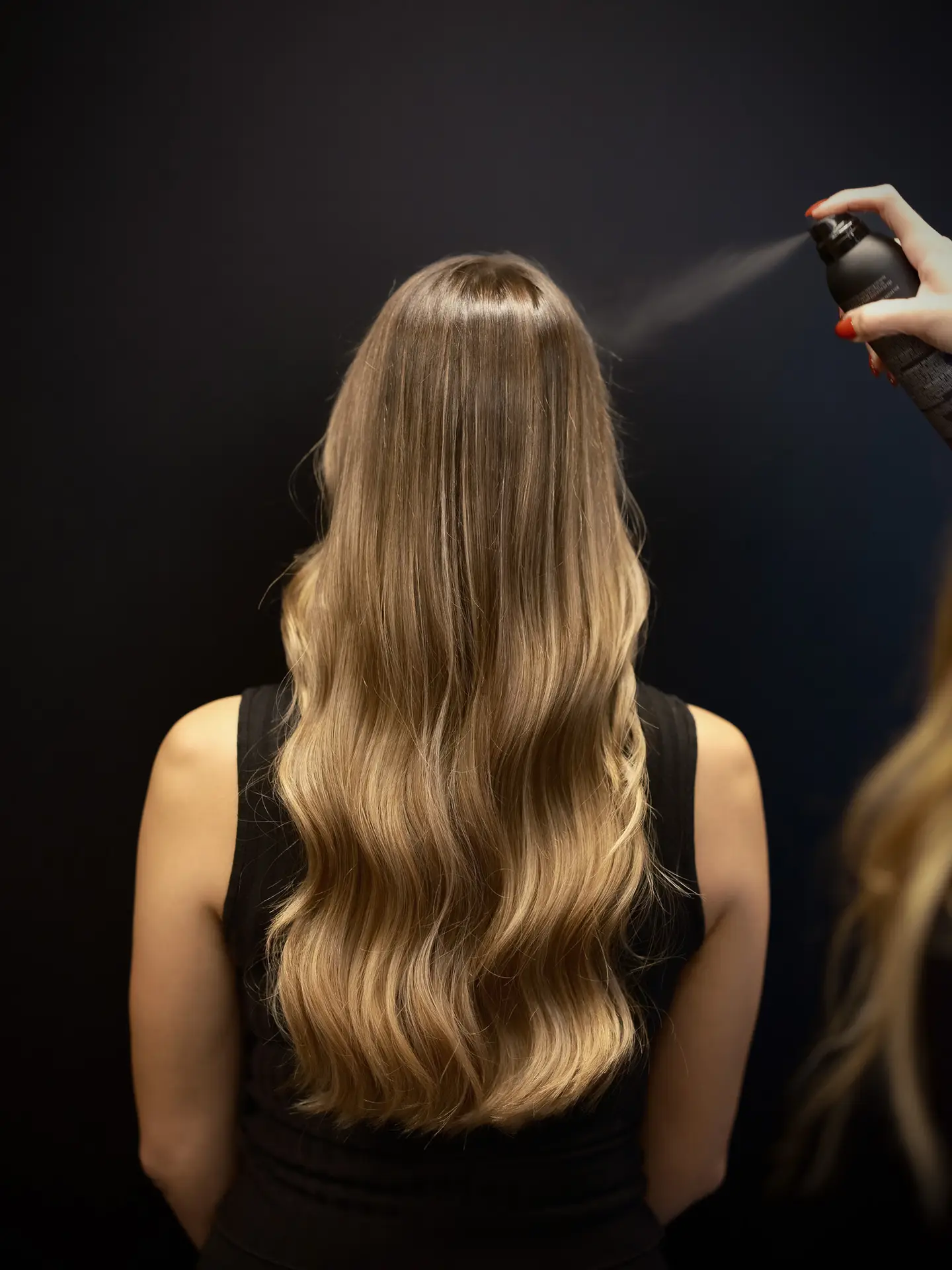 Luxury sew-in hair extensions with styled waves in Miami salon
