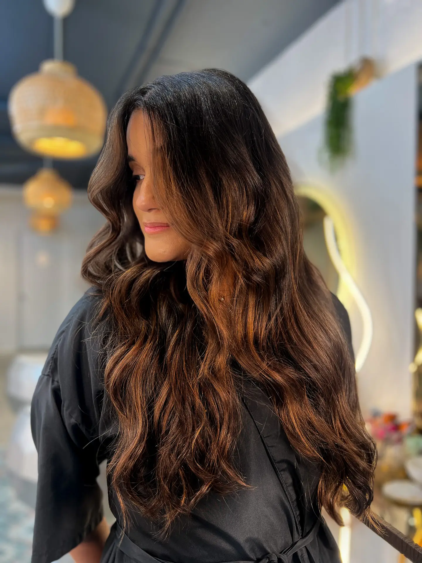 Wavy brown balayage hairstyle at luxury Miami salon Arvel Hair
