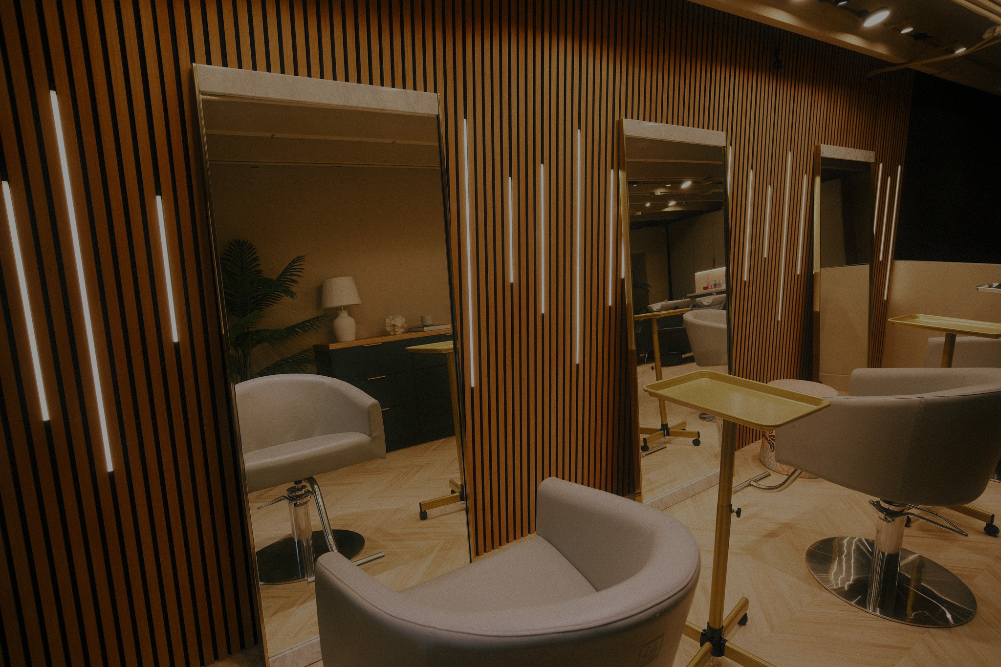 Styling chairs and mirrors inside Arvel Hair salon, Miami